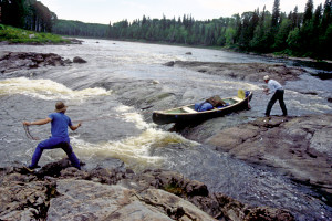 Rob and Larry lining the canoe at Devil Rapids.