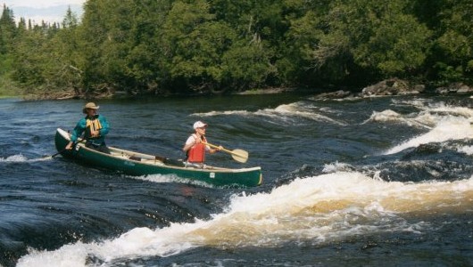 Running rapids on the White River in Canada