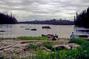 Resting on rock island amid Albany Rapids.